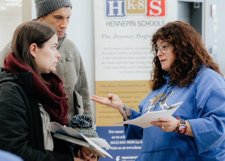 Parents speaking to the teacher.